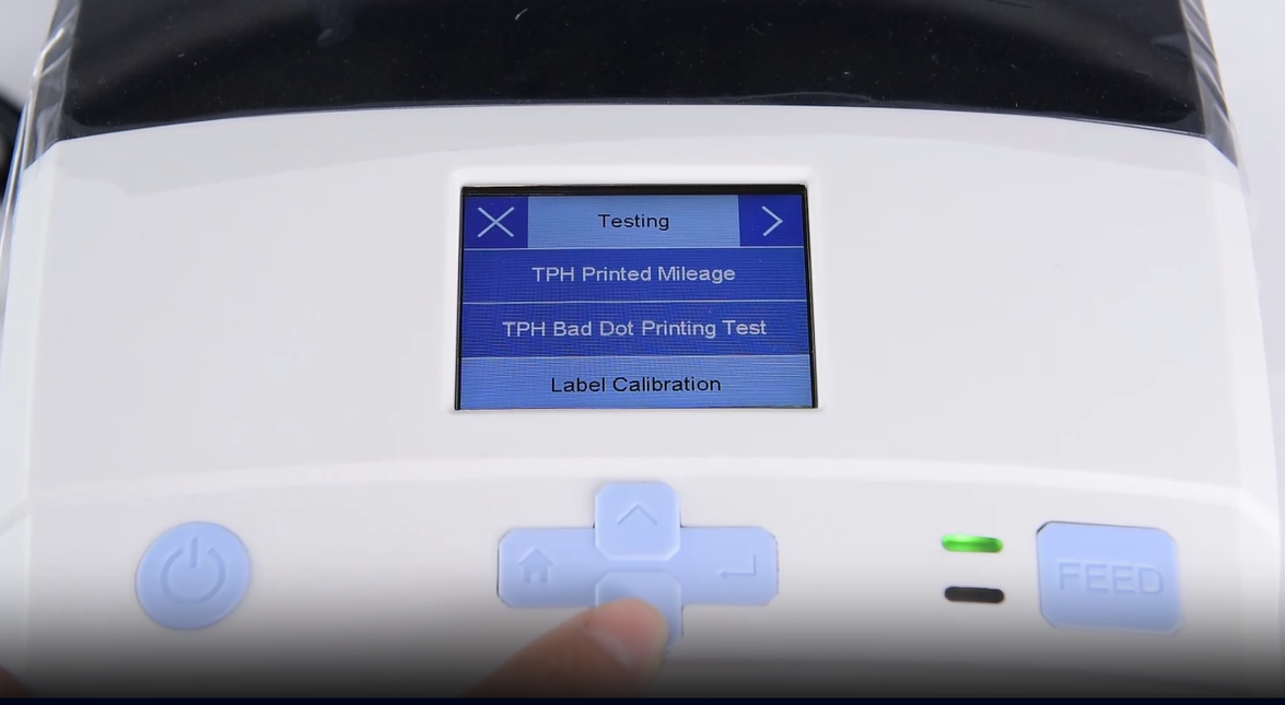 W A close-up of a machine's digital interface showing a testing menu.